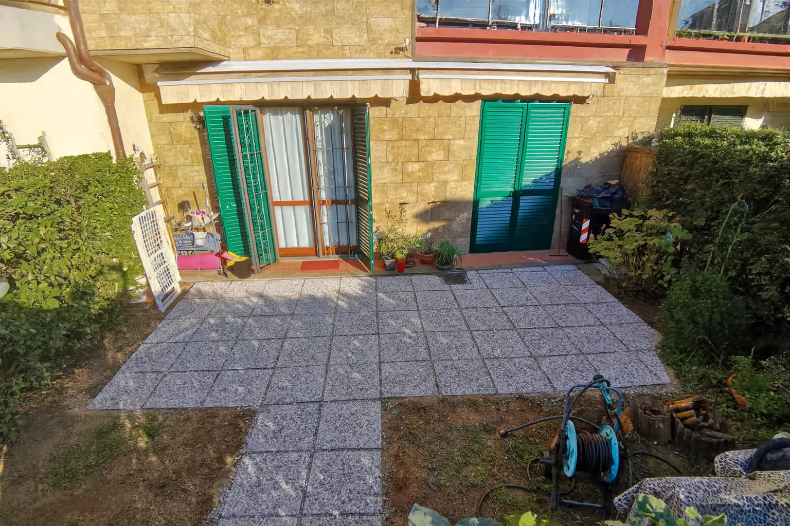 Outdoor paving with grit tiles for a residential exterior area in South Florence